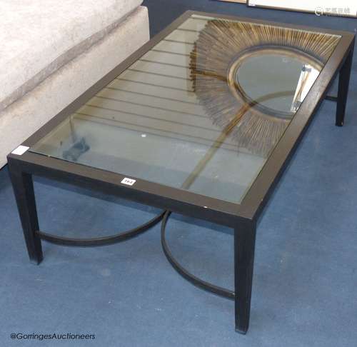 An ebonised ash and glass coffee table, 120 cm long, 70 cm d...