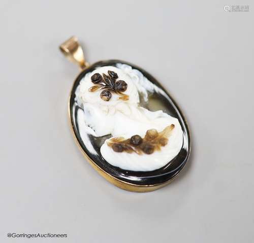 A late Victorian gilt metal mounted oval banded agate pendan...