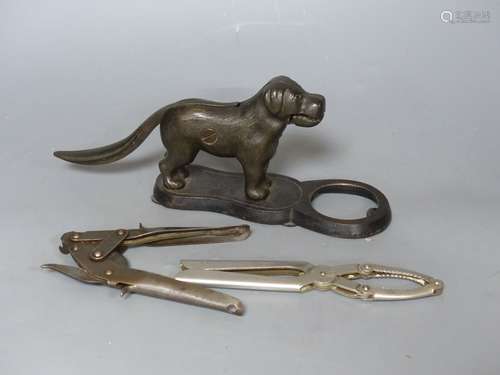 Two metal nutcrackers, and a tin? opener widest 28cm