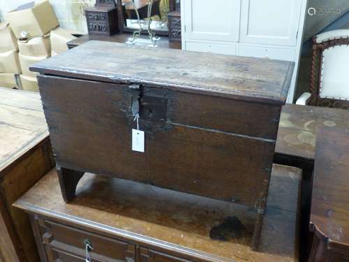 A 17th century oak six plank coffer with candle box (top a.f...