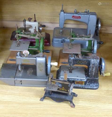 Seven miniature sewing machines