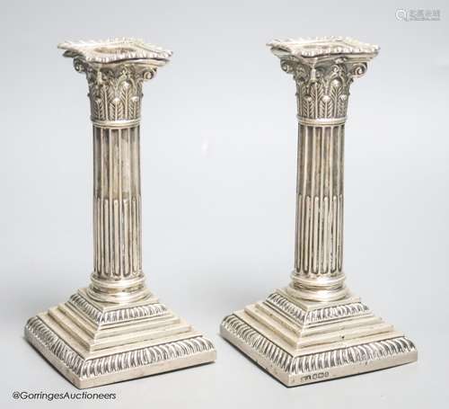 A pair of late Victorian silver Corinthian column dwarf cand...