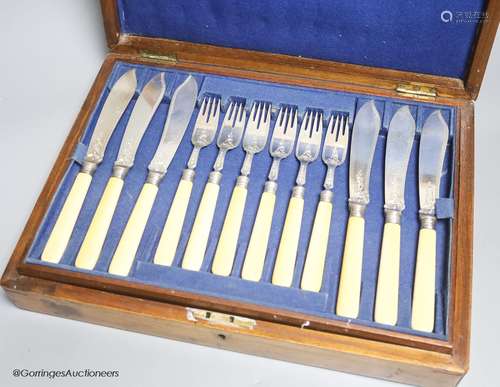 A Victorian cased set of eighteen pairs of ivory handled eng...