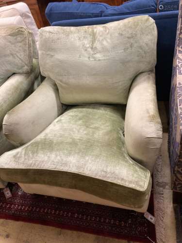 A George Smith Howard style armchair upholstered in pale gre...