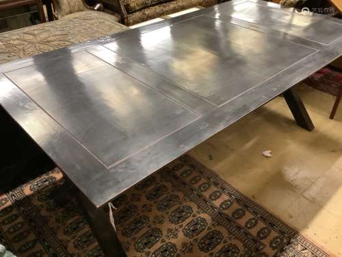 A contemporary ebonised dining table, width 200cm depth 100c...