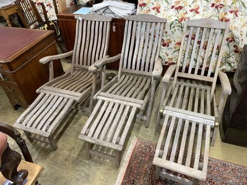 A pair of Alexander Rose teak folding steamer chairs and one...
