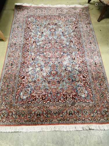 A Kashan style part silk blue ground rug, 185 x 123cm
