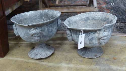 A pair of early 20th century lead garden urns, diameter 26cm...