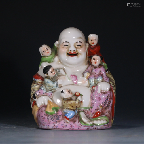 A CHINESE FAMILLE ROSE STATUETTE OF MAITREYA AND KIDS