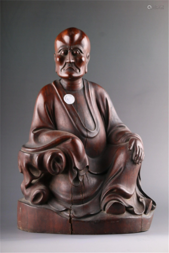 A CHINESE HARDWOOD CARVED STATUETTE OF ARHAT