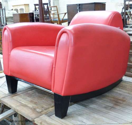 A red leather club armchair, height 70cm, width 87cm, depth ...