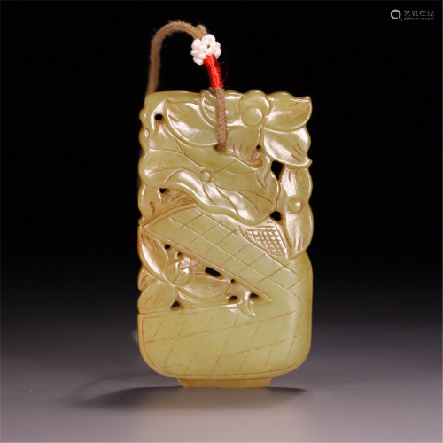 A CHINESE YELLOW JADE CARVED LOTUS PENDANT