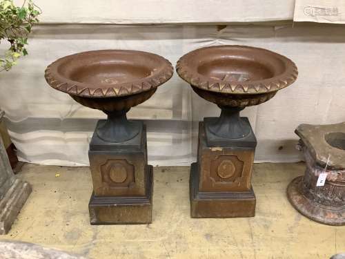 A pair of glazed stoneward garden urns on pedestals, height ...