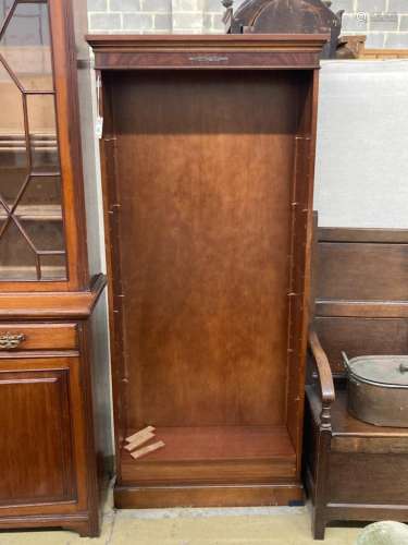A reproduction mahogany open fronted bookcase, length 82cm, ...
