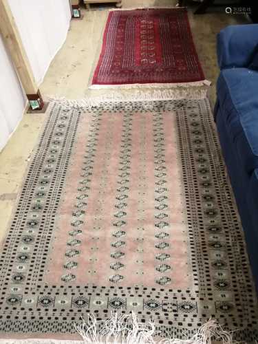 A Bokhara style rug, 166 x 97cm and another pale pink ground...