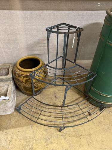 A wrought iron three tier plant stand, height 75cm and a tin...