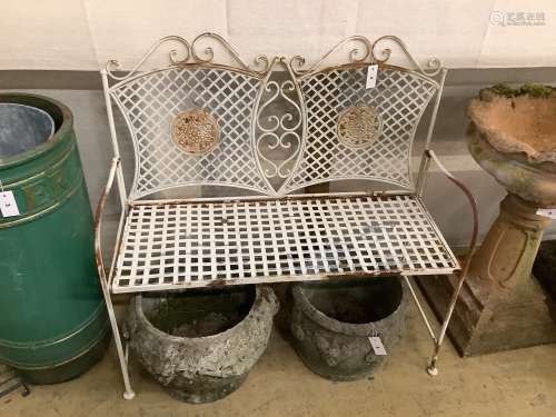 A wrought iron folding garden bench, length 103cm