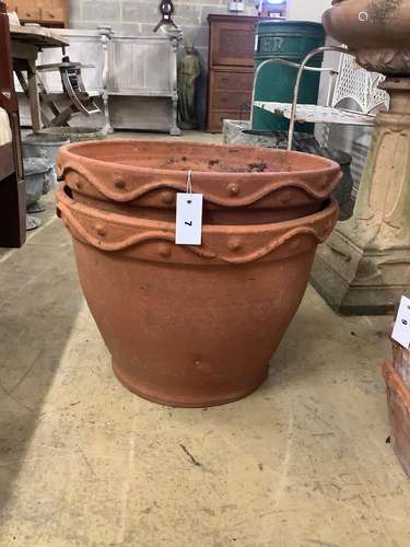 A pair of circular terracotta garden planters, diameter 51cm