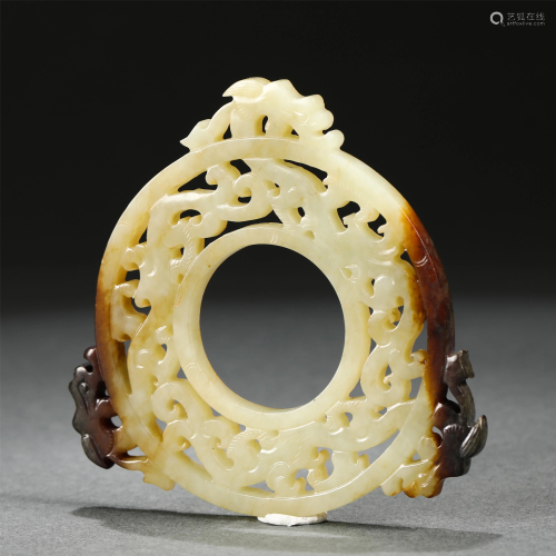 A CHINESE HOLLOW CARVED BEASTS JADE BI