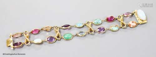 An early 20th century yellow metal and multi gem set bracele...