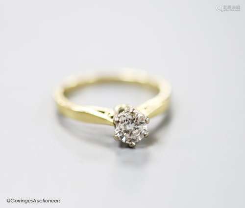 A modern 18ct gold and solitaire diamond ring, size L, gross...