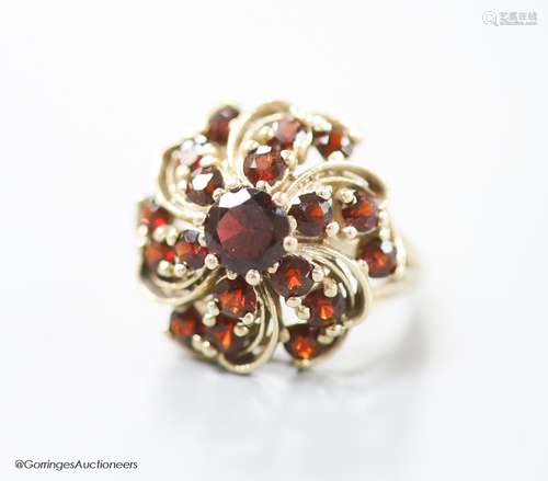 A modern 14ct gold and garnet cluster dress ring, size M/N, ...