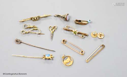 A small collection of stick pins, 'ladder and key' fob seal,...