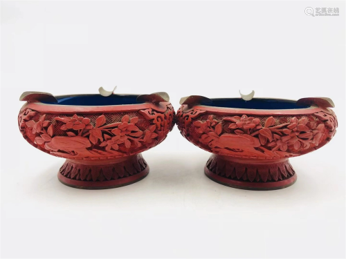 A PAIR OF CARVED LACQUER FLORAL STEM ASHTRAYS