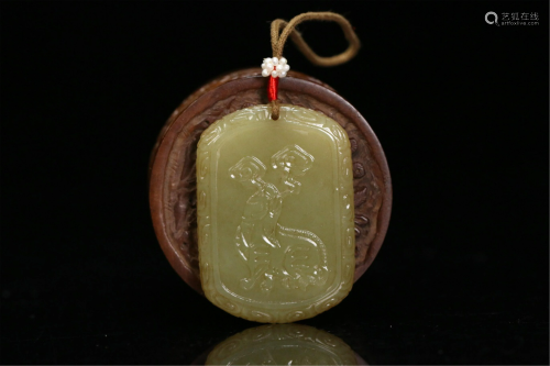 A CHINESE YELLOW JADE CARVED PENDANT