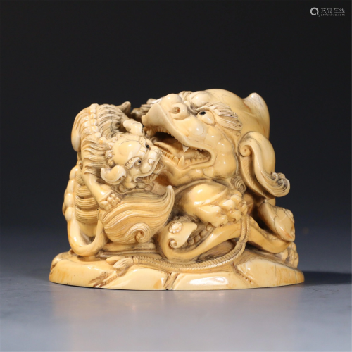 A CHINESE IVORY CARVING OF MOTHER-AND-SON BEAST