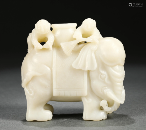 A CHINESE JADE CARVING OF KIDS RIDING AN ELEPHANT