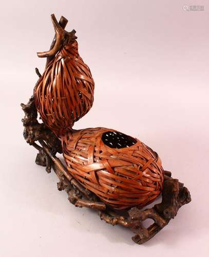 A JAPANESE MEIJI WOVEN DOUBLE GOURD FORMED IKEBANA BASKET, w...