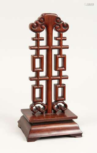 A CHINESE CARVED AND PIERCED WOODEN STAND, 12ins high.