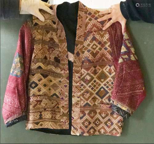 AN ETHNIC EMBROIDERED SHORT JACKET, constructed from laos we...