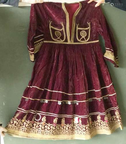 AN AFGAN PLUM VELVET AND HAND EMBROIDERED RIDING DRESS.