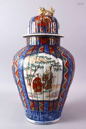 A LARGE IMARI VASE AND COVER, the ribbed body painted with p...