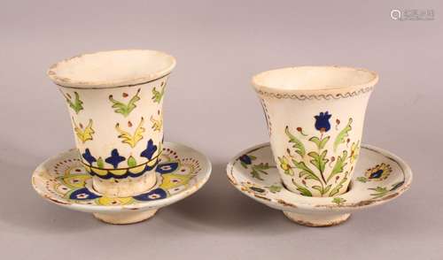 TWO TURKISH CUPS & SAUCERS - with floral motif decoration (4...