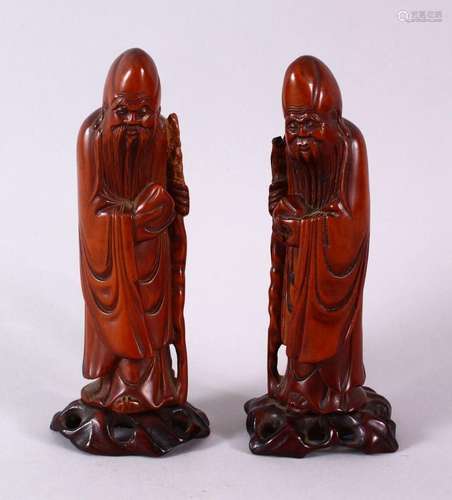 A PAIR OF 19TH CENTURY CHINESE CARVED BOXWOOD FIGURES OF SHO...