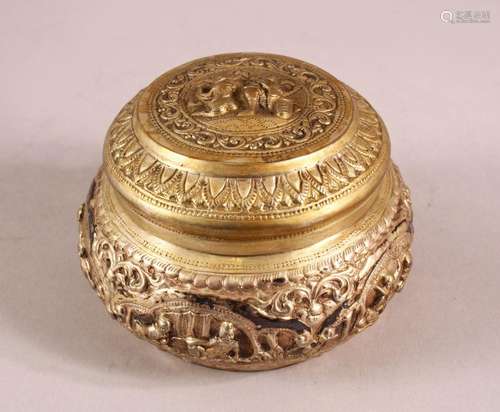 A BURMESE SILVER EMBOSSED BOX & COVER with moulded figural d...