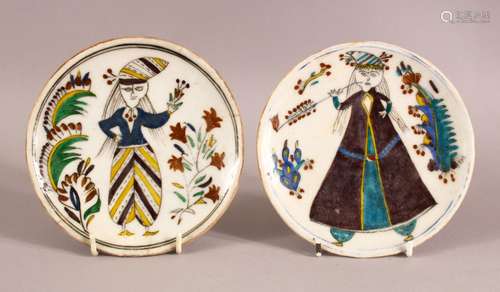 2 TURKISH KUTAHYA POTTERY PLATES - EACH DEPICTING A FIGURE -...