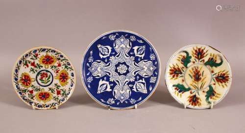 A MIXED LOT OF THREE TURKISH KUTAHYA POTTERY PLATES - one bl...