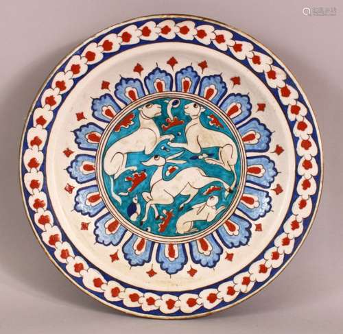 A LARGE TURKISH IZNIK POTTERY PLATE - decorated central with...