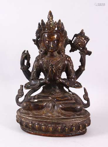 A GOOD TIBETAN BRONZE FIGURE OF A FOUR ARMED DEITY, 25cm hig...