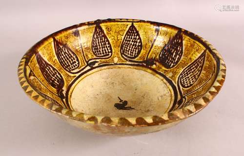 A NISHAPUR YELLOW GLAZED POTTERY BOWL, the centre with a sty...