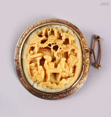 A CHINESE CANTON CARVED IVORY BROOCH, mounted in gold colour...