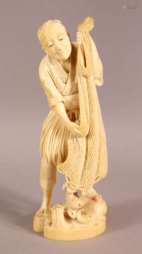 A FINE QUALITY JAPANESE MEIJI PERIOD CARVED IVORY OKIMONO OF...