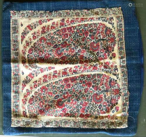 AN EARLY 19TH CENTURY KASHMIR SHAWL FRAGMENT mounted as a cu...