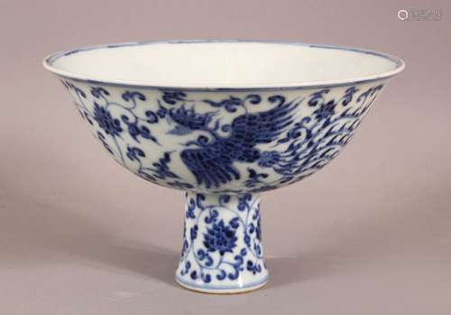 A CHINESE BLUE AND WHITE STEM CUP, the bowl painted with pho...