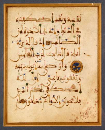 A FRAMED AND GLAZED KUFIC CALLIGRAPHIC MANUSCRIPT PAGE, doub...