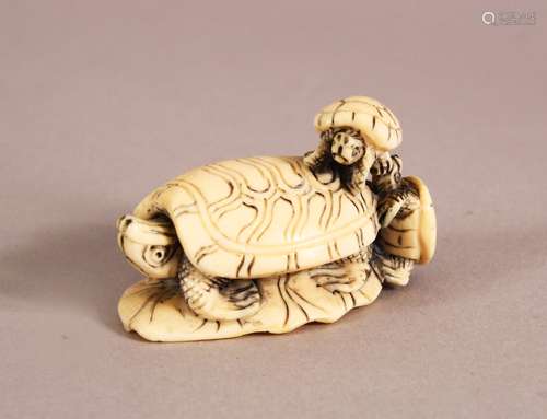 A JAPANESE MEIJI PERIOD CARVED IVORY NETSUKE in the form of ...